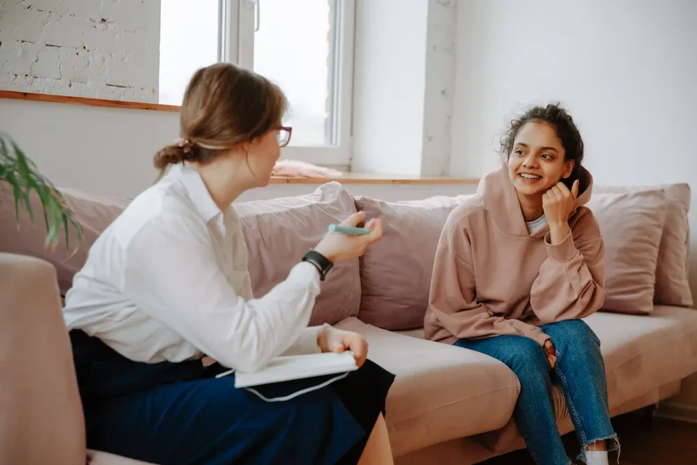 teenager in therapist's office