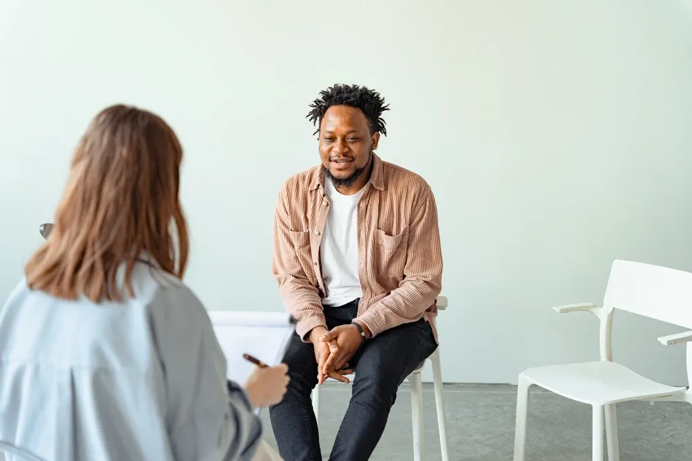 teenager in therapist's office